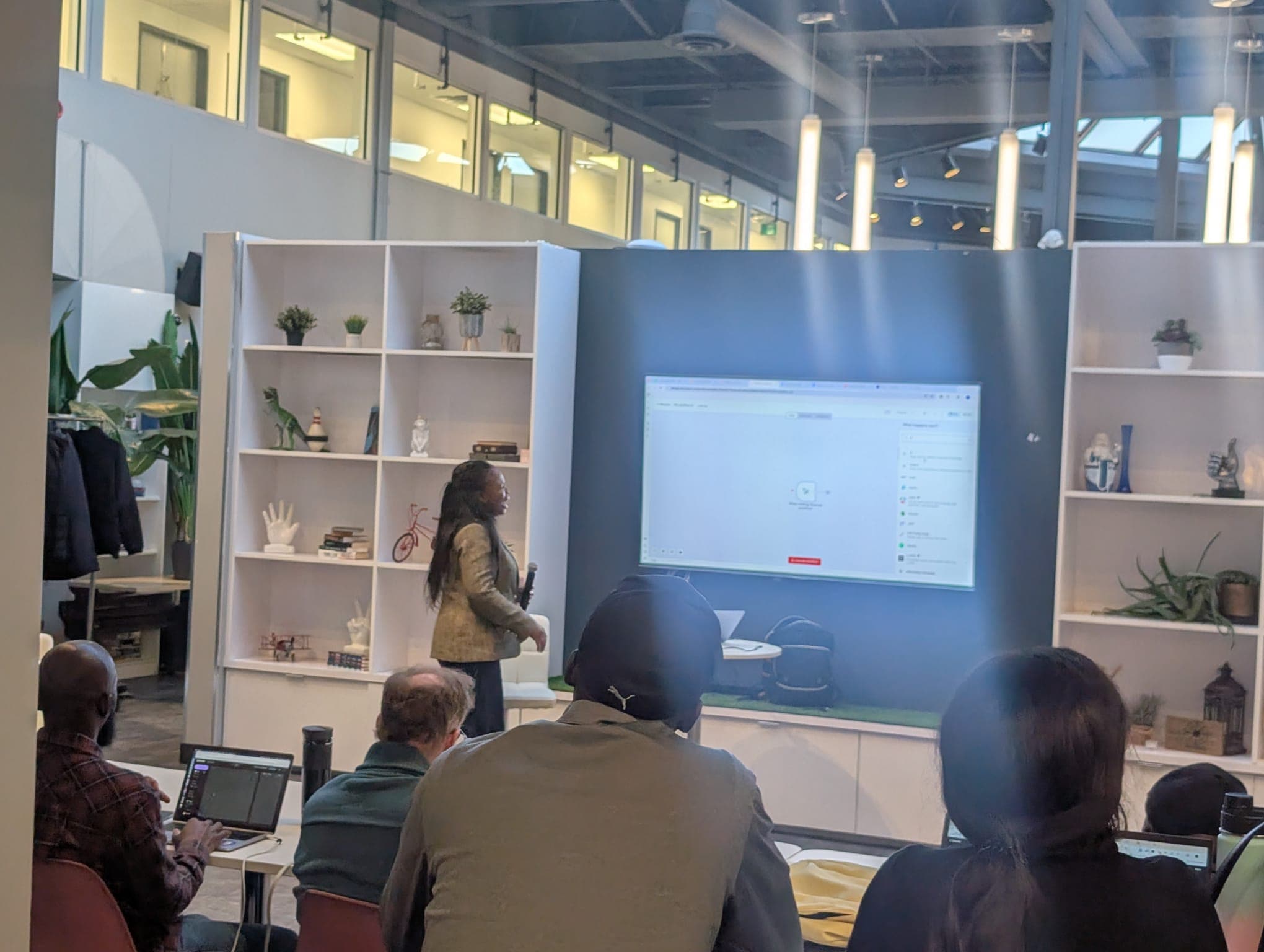 Stephanie Nyarko leading a hands-on AI training session for a room of professionals